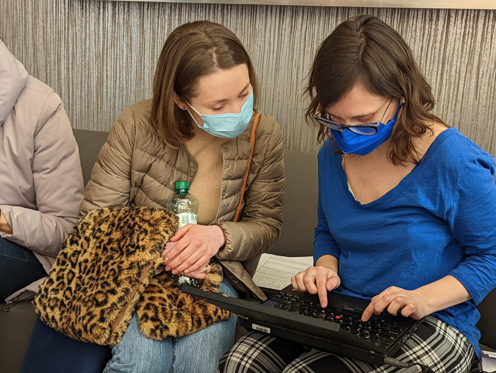 two ladies working on a laptop