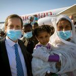 Operation Zur Israel 3 - Ethiopian Jewish Agency Chairman Isaac Herzog with new Ethiopian olim (Credit: Olivier Fitoussi, courtesy of The Jewish Agency for Israel)