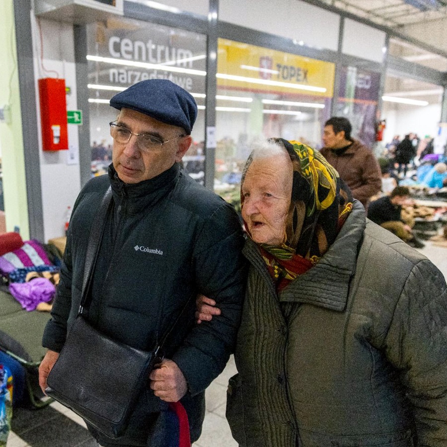 elderly Ukrainian Holocaust survivor assisted by Jewish Agency staff